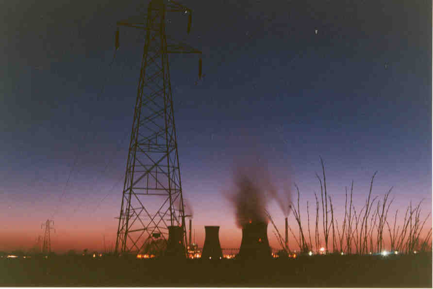 Night time view of the distant power station, back-lit by the last vestigaes of the sunset