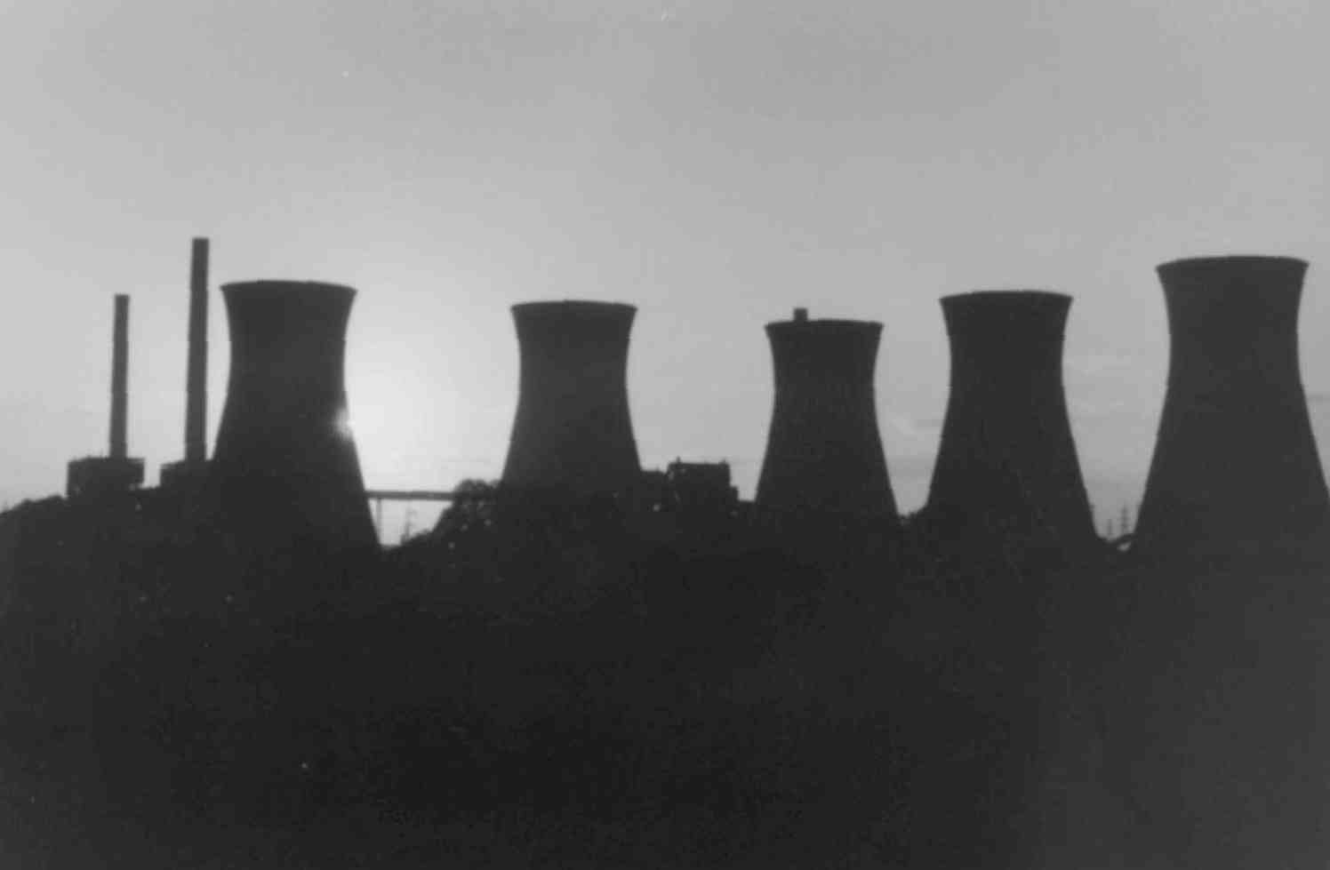 Cooling towers silouetted in a black & white image